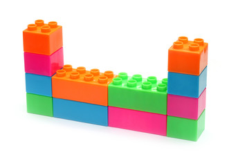 Colorful plastic toy bricks make wall