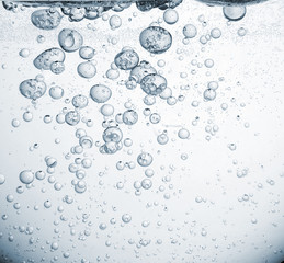 Floating Water Droplets Against Light Background