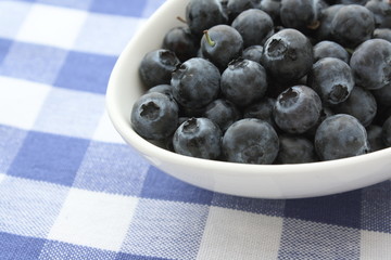 Ripe Blueberries in a bowl on the table