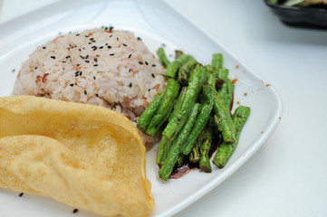 Healthy unpolished red rice and beans