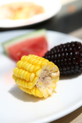 watermelon and maize in the plate.