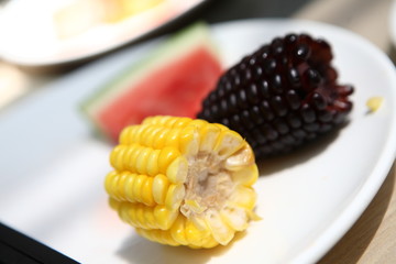 watermelon and maize in the plate.
