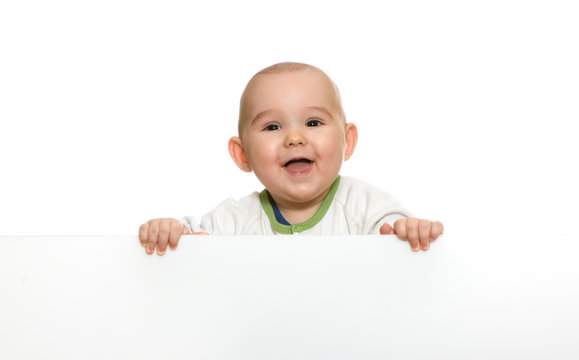 cute baby boy holding empty blank board