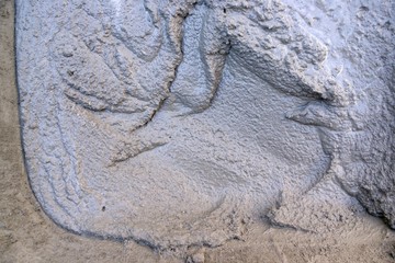 Background:fresh cement in wheelbarrows