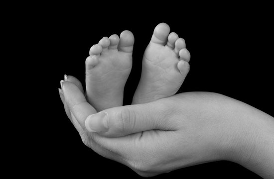 Baby Feet in Mothers Hand