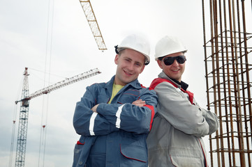 happy builders at construction site