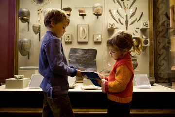 boy and little girl at excursion in historical museum - obrazy, fototapety, plakaty