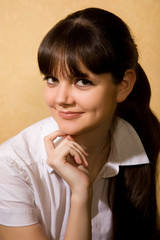 beautiful young brunette woman in white blouse