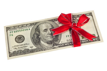 A US hundred dollar bill wrapped by ribbon isolated on white