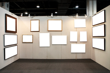 empty frames in a room against a white wall .