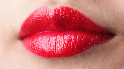 Female lips with red lip gloss