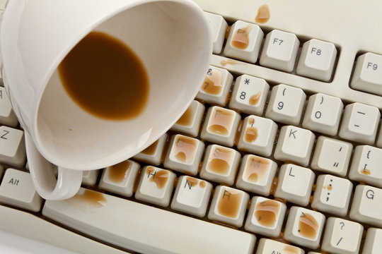 Coffee And Damaged Computer Keyboard