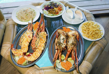plates with lobster on table