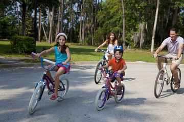 Fototapeta premium Modern Family Parents and Children Cycling
