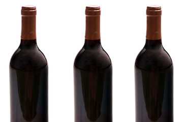 Three wine bottles isolated on white background, studio shot