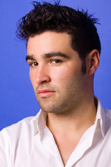 Fototapeta premium casual young man portrait over a blue background