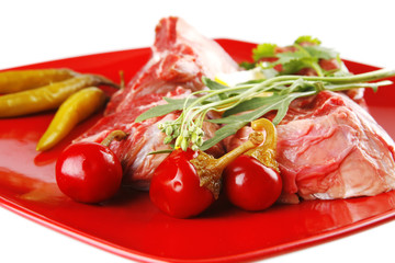 raw beef medallion on red