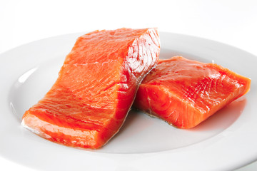 pink smoked salmon on white plate
