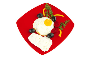 egg on red dish with vegetables