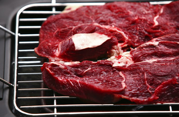uncooked meat on bbq