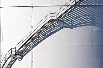 white tanks in tank farm with staircase