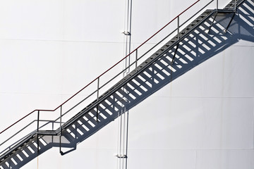 white tanks in tank farm with staircase