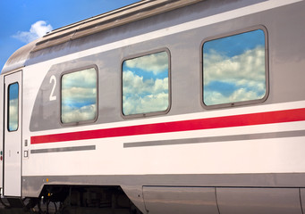 Train with cloud reflections