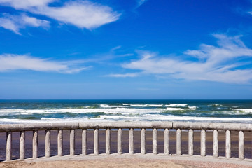 Fototapeta premium Ocean coastline landscape with railings on a foreground