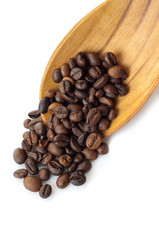 coffe beans over spoon - chicchi di caffe'