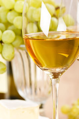 Still-life with bunch of grapes and white wine