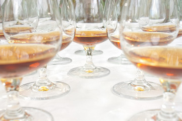Row of drink glasses on table with selective focus