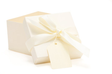 partially opened cream colored gift box
