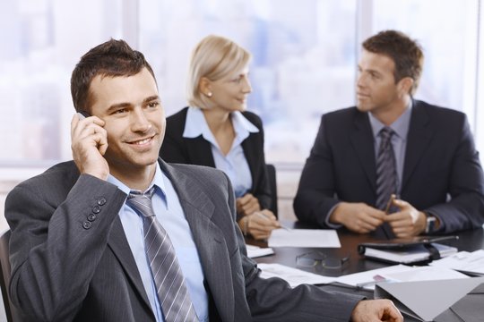 Businessman on call in office