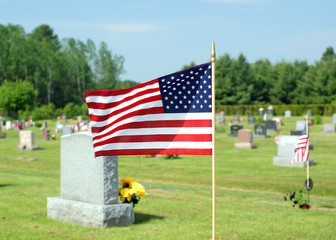 Small American flag waving in cemetery