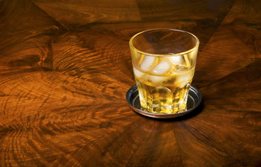 Whiskyglass on furniture