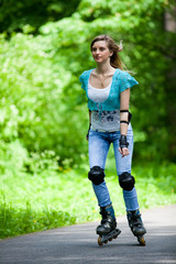 Fototapeta premium Young woman rollerskating