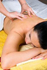 Fototapeta na wymiar Woman getting back massage at spa