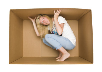 Woman inside a Cardboard Box - obrazy, fototapety, plakaty