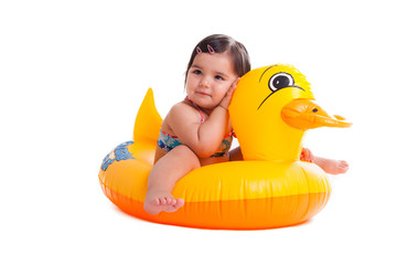 A thoughtful girl sitting in an air-toy