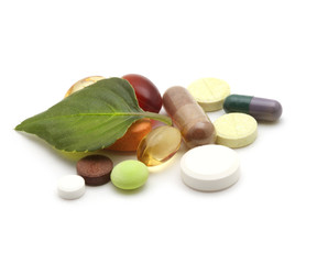 vitamins, tablets, pill and green leaf