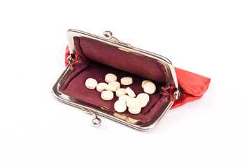 Old red purse against with  tablets
