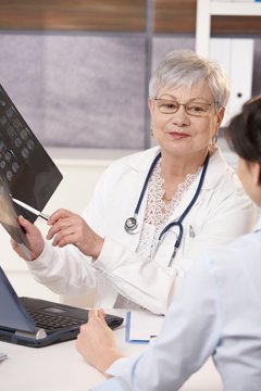 Doctor showing scan results to patient