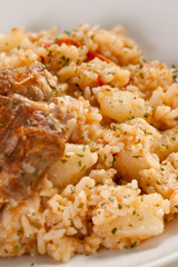 plate of rice and pork chops potatoes
