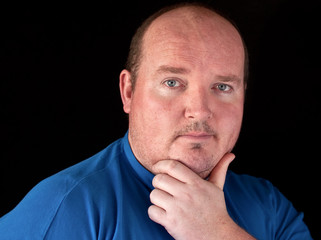 Obraz premium closeup portrait capture of a male on black background