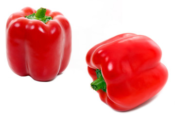 Two red paprikas isolated on white, studio shot