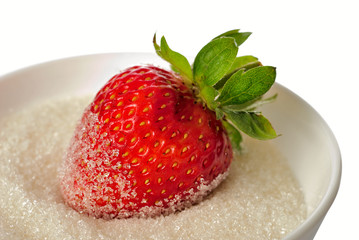 Strawberry in bowl with sugar isolated