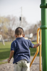 Obraz premium Multi-racial boy at the park