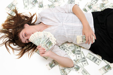 The girl lays on money