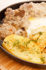 Meat plate with potatoes