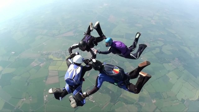 Four skydivers in freefall